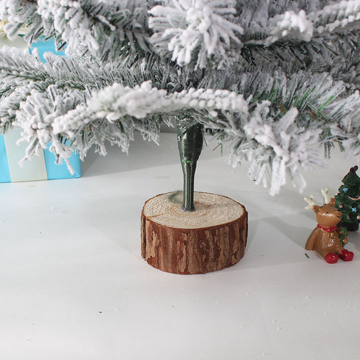 Mini Christmas tree for the table, snow-covered, with lighting