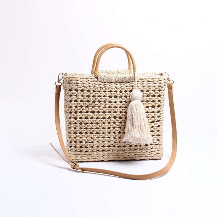 Handcrafted straw shoulder bag with decorative tassel pendant Bowlift