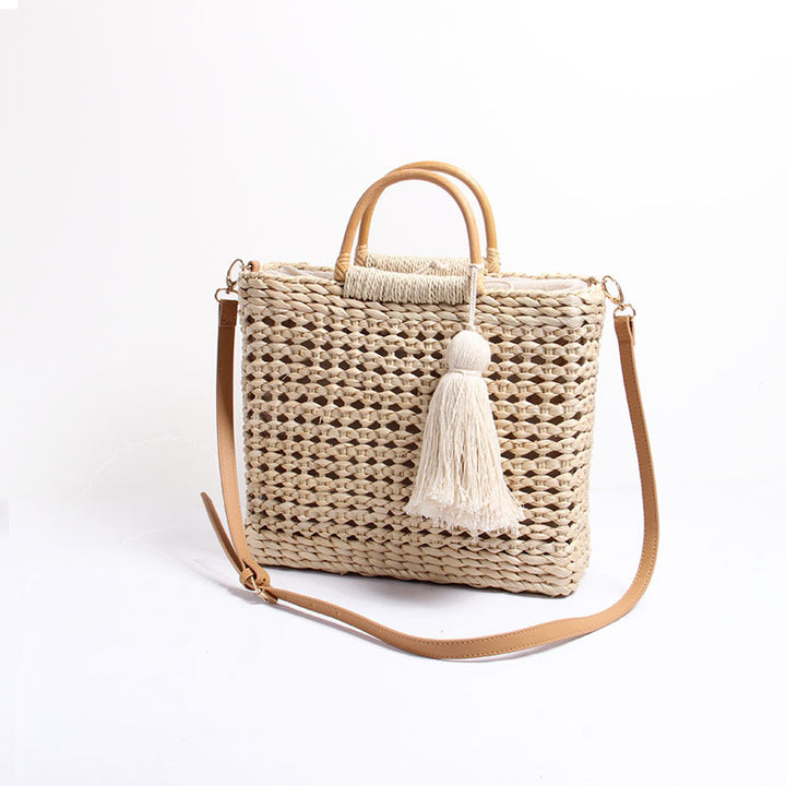 Handcrafted straw shoulder bag with decorative tassel pendant Bowlift