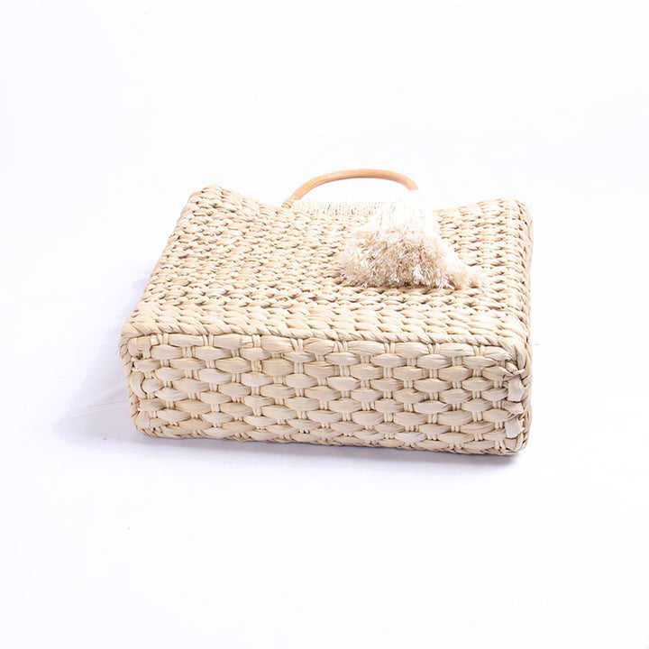 Handcrafted straw shoulder bag with decorative tassel pendant Bowlift