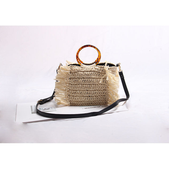 Handmade raffia shoulder bag with fringed accents Bowlift