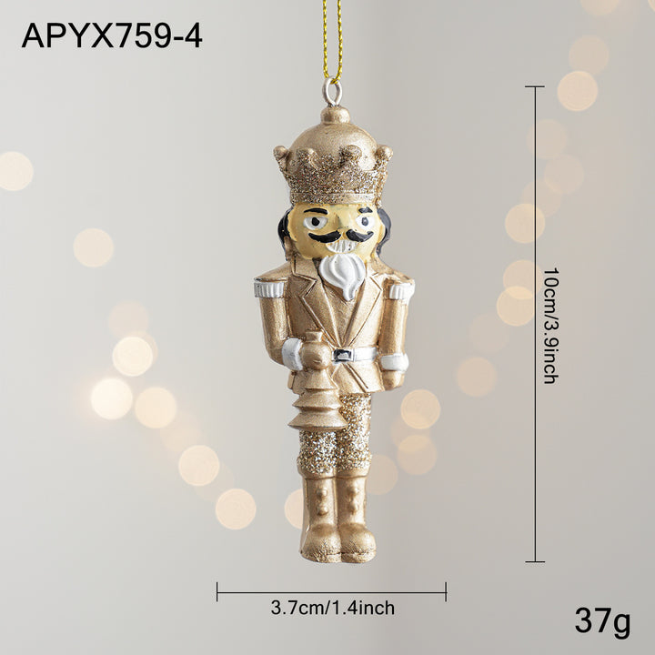 Golden nutcracker pendant made of resin for the Christmas tree