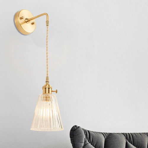 BowLift | A wall light with a bulb and conical shade made of clear, textured glass, industrial bedroom wall light fixture