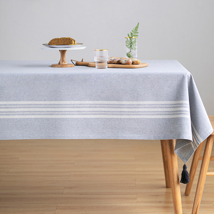 Rectangular linen look tablecloth with fringed tassels and side stripe border design Bowlift