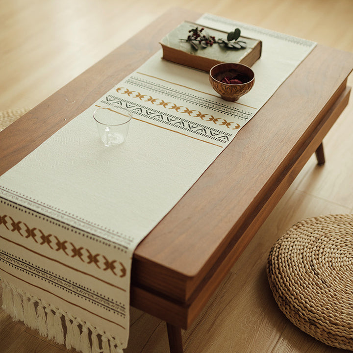 Woven Boho table runner made of cotton blend with decorative fringes and graphic stripe pattern Bowlift