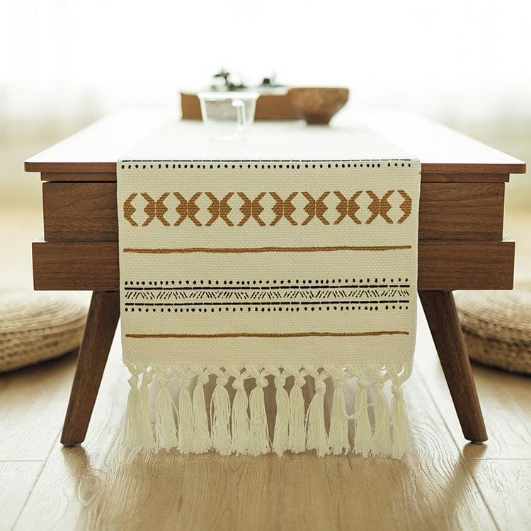 Woven Boho table runner made of cotton blend with decorative fringes and graphic stripe pattern Bowlift