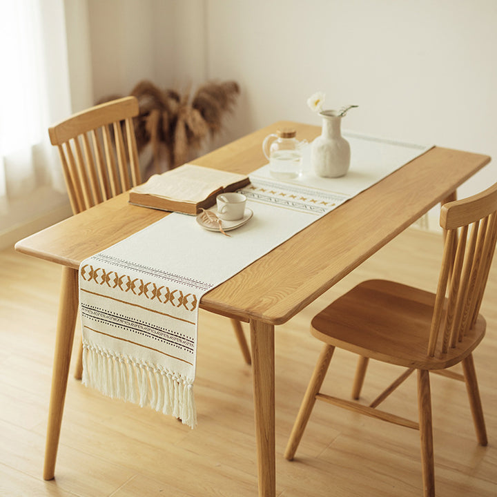 Woven Boho table runner made of cotton blend with decorative fringes and graphic stripe pattern Bowlift