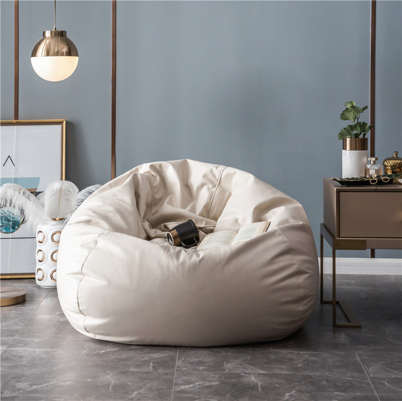 Large format bean bag lounge chair made of water-repellent canvas with a shape-stable foam filling core