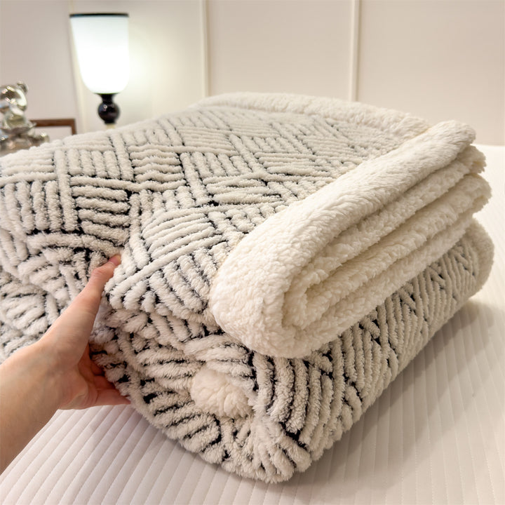 Patterned cuddle blanket with lamb fleece look