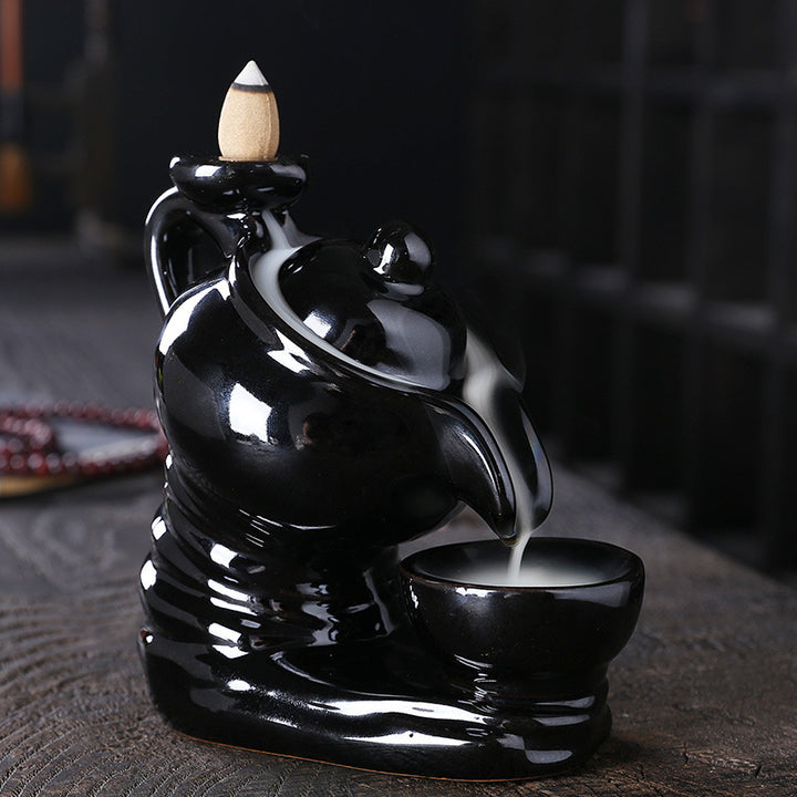 Elegant ceramic teapot-shaped incense burner