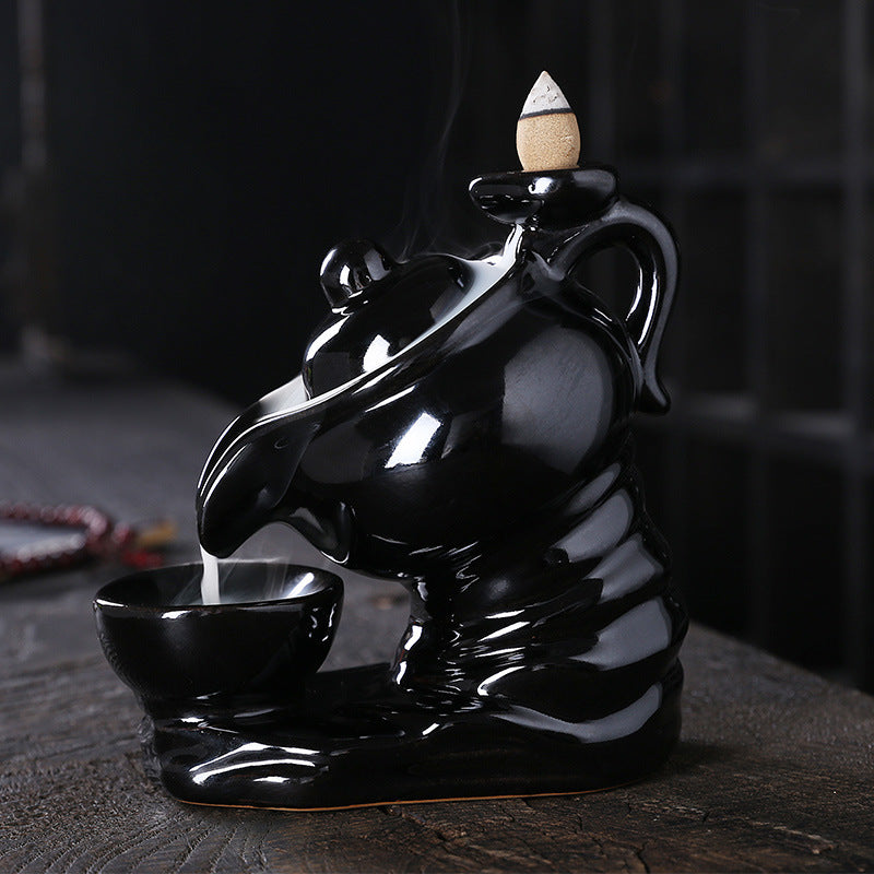 Elegant ceramic teapot-shaped incense burner