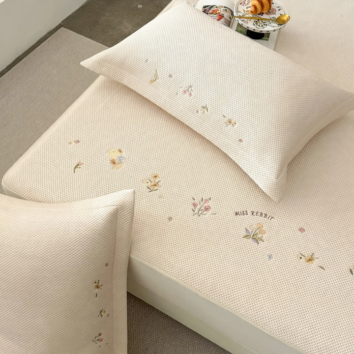 Embroidered bed sheets with floral pattern and pillowcases