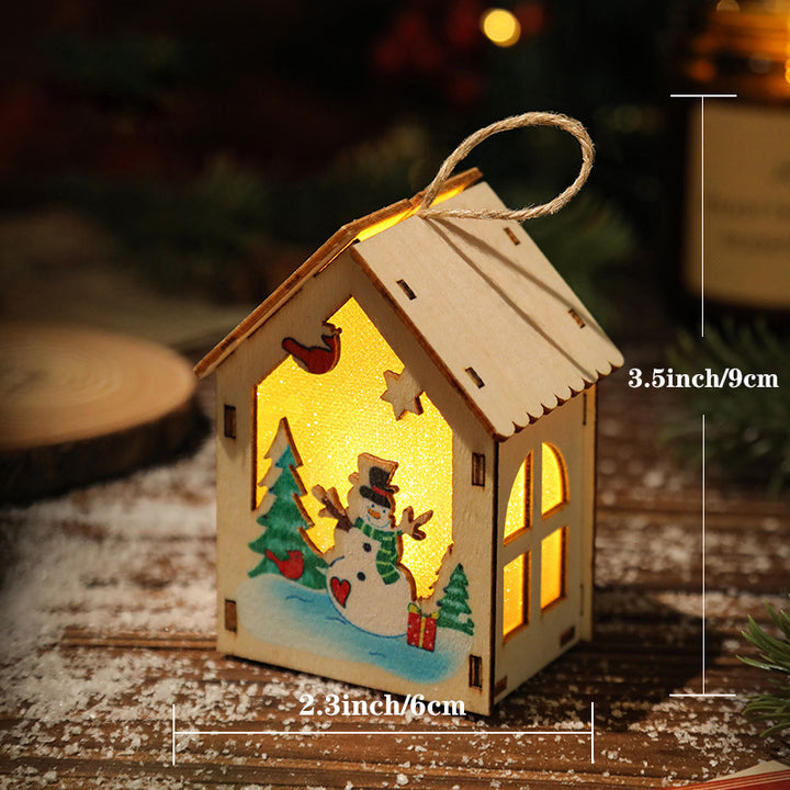 Illuminated wooden Christmas house for table decoration