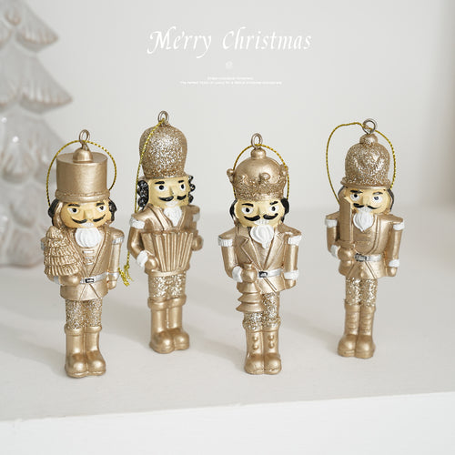 Golden nutcracker pendant made of resin for the Christmas tree