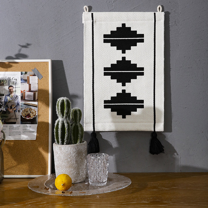 Woven wall hanging with graphic ethnic relief and tassels Bowlift