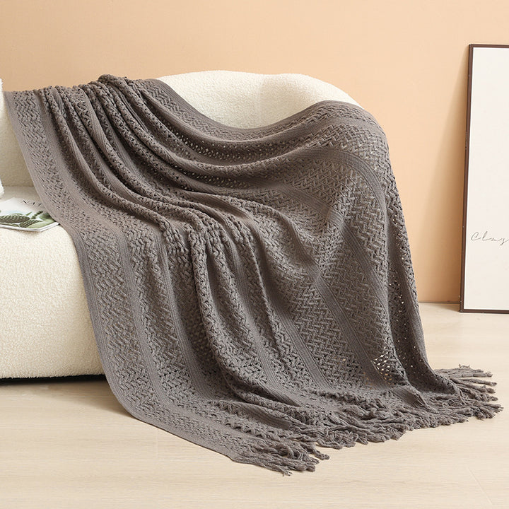 Decorative knitted blanket with fringes