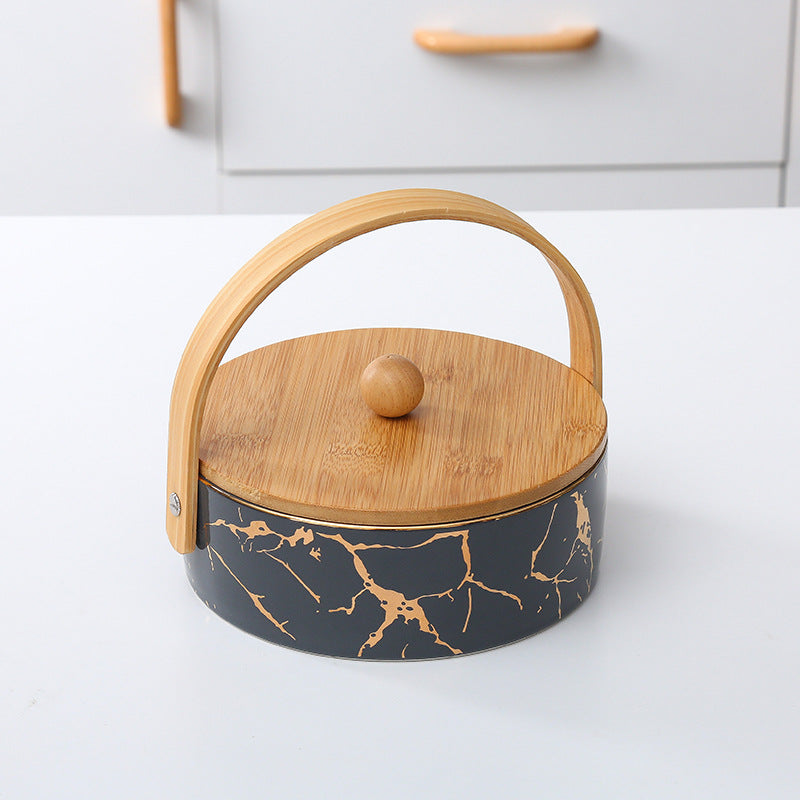 Kitchen organizer with bamboo handle and four-part insert, marbled snack bowl
