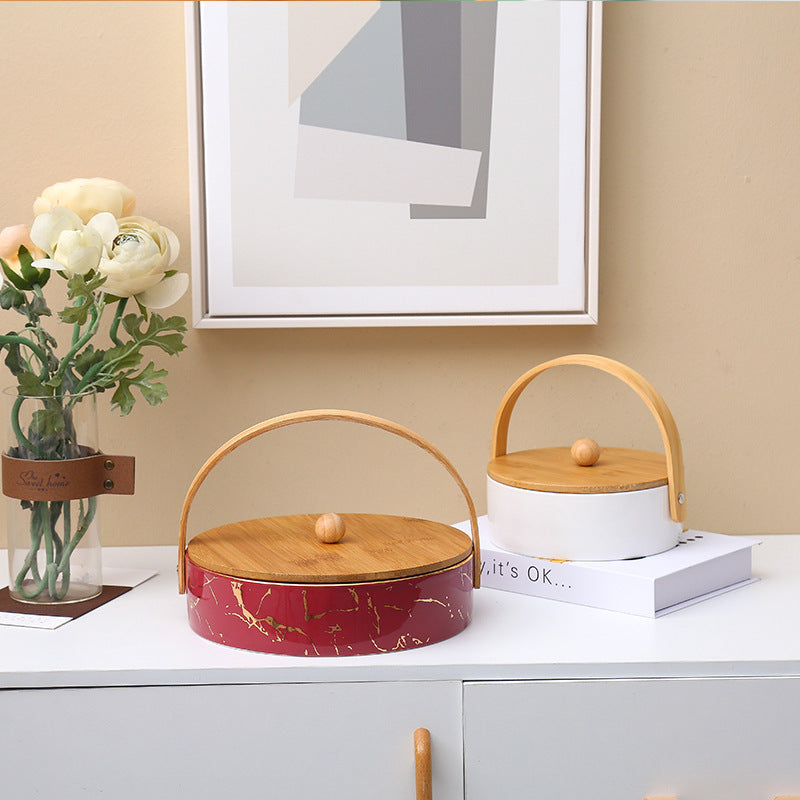 Kitchen organizer with bamboo handle and four-part insert, marbled snack bowl