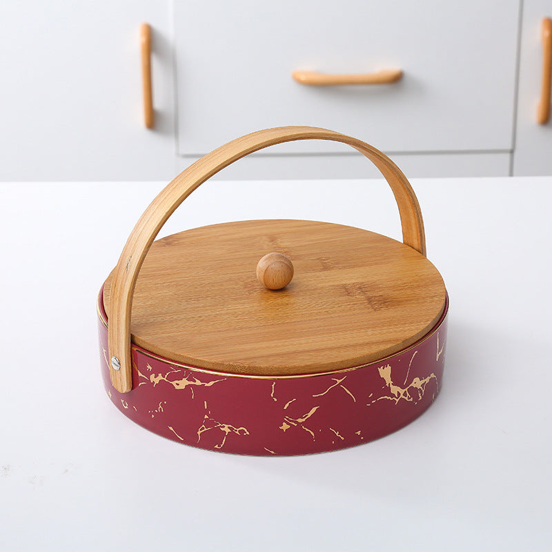 Kitchen organizer with bamboo handle and four-part insert, marbled snack bowl