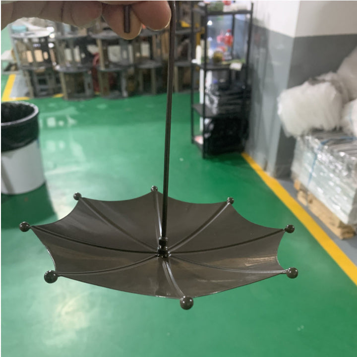 Birdbath made of iron in umbrella shape