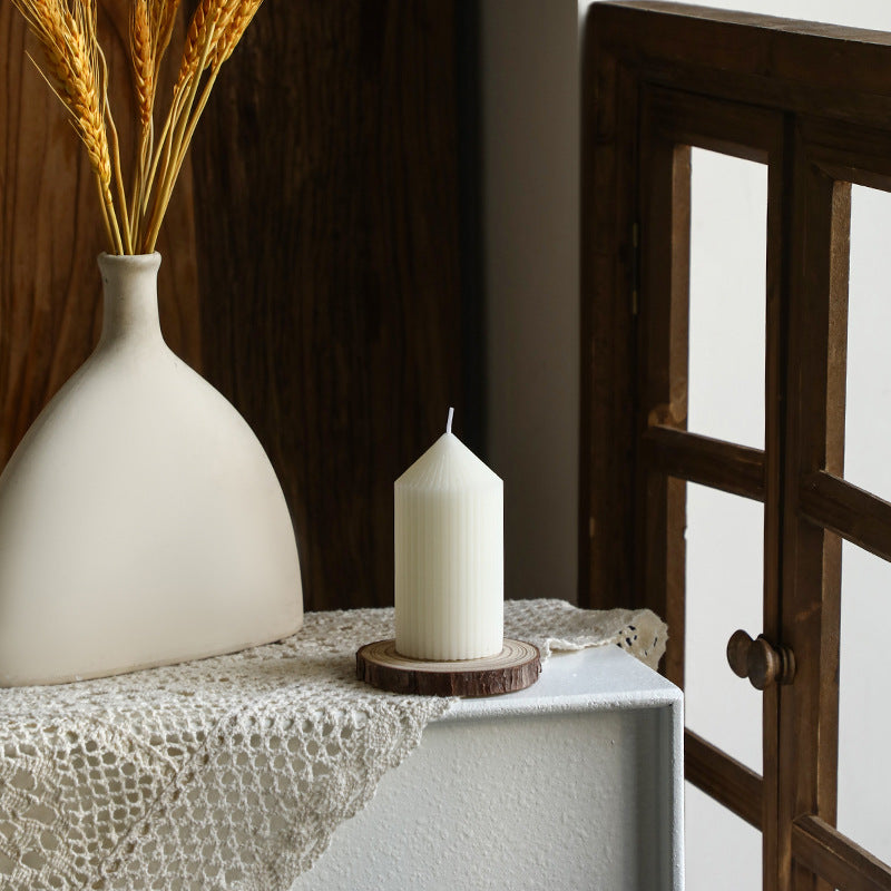 White tapered candle with striped pattern, Nordic