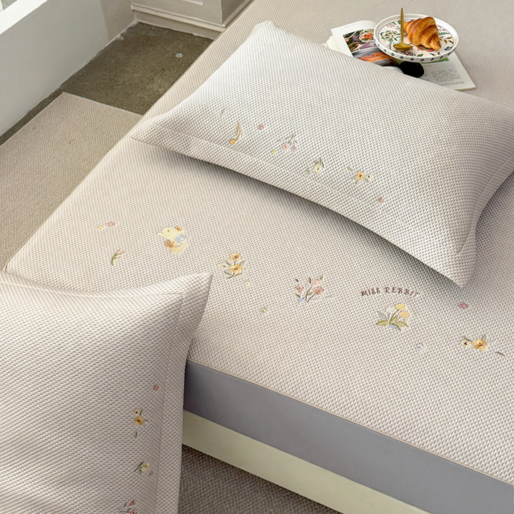 Embroidered bed sheets with floral pattern and pillowcases