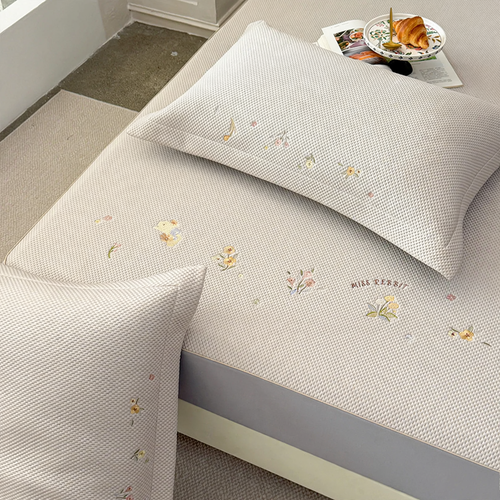 Embroidered bed sheets with floral pattern and pillowcases