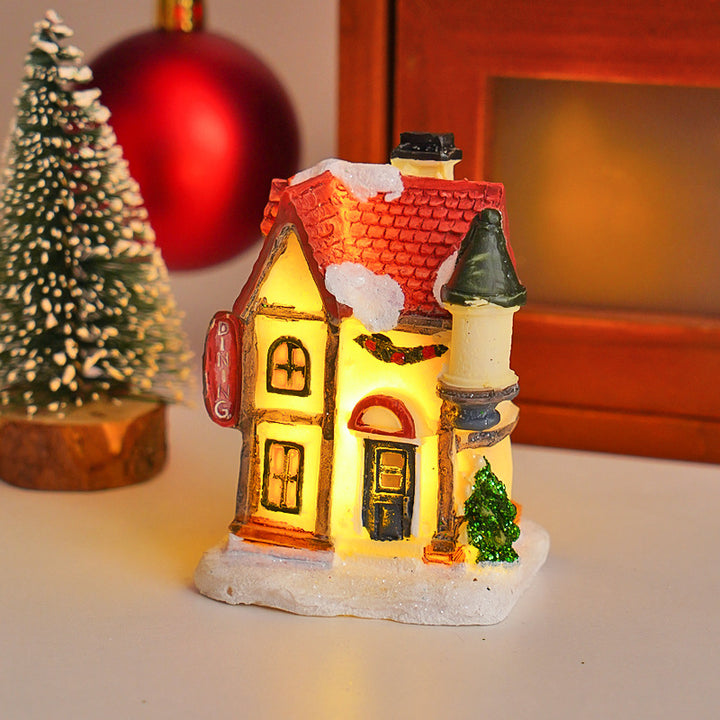 Illuminated Christmas cottage made of resin