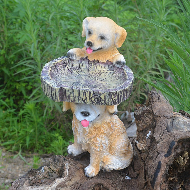 Decorative animal-bird feeding station made of synthetic resin