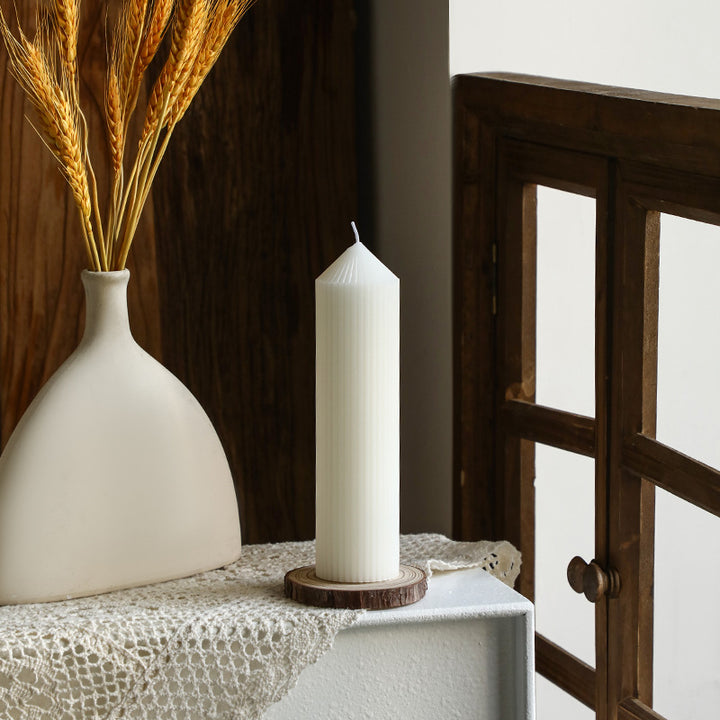 White tapered candle with striped pattern, Nordic