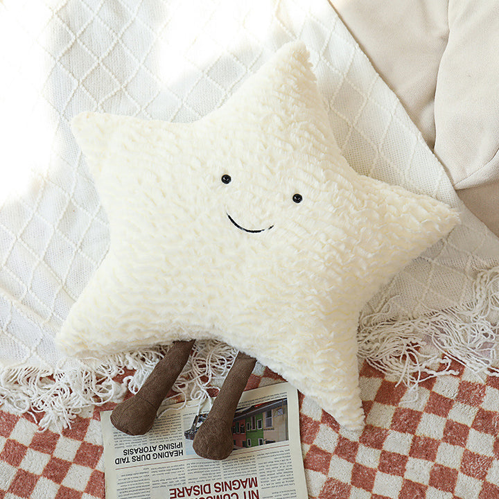 Decorative cuddle cushions with moon, star, and sun motif