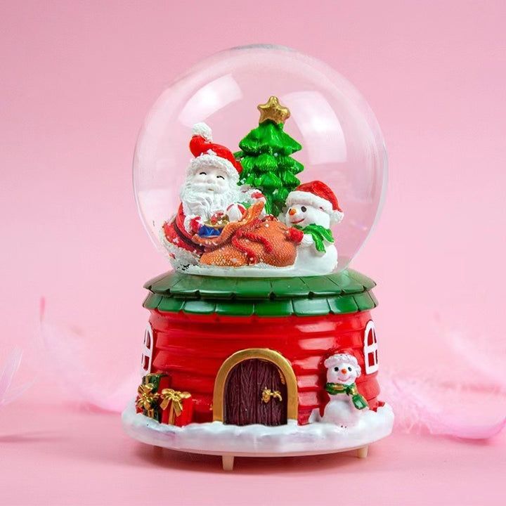 Illuminated snow globe music box with music