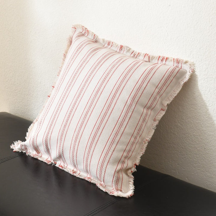 Square decorative pillow with stripe pattern