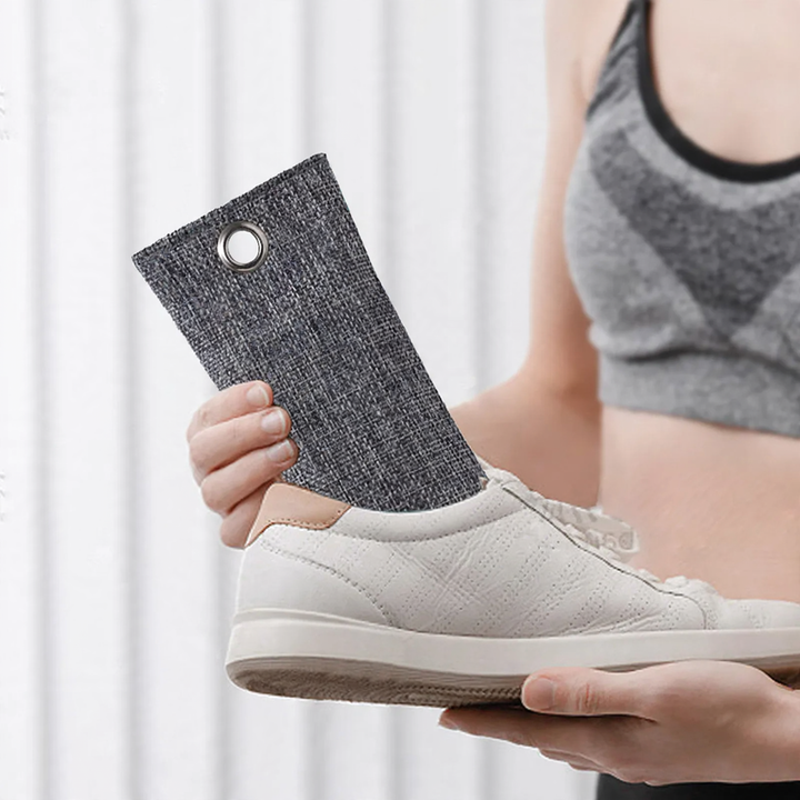Activated carbon shoe bags for odor neutralization