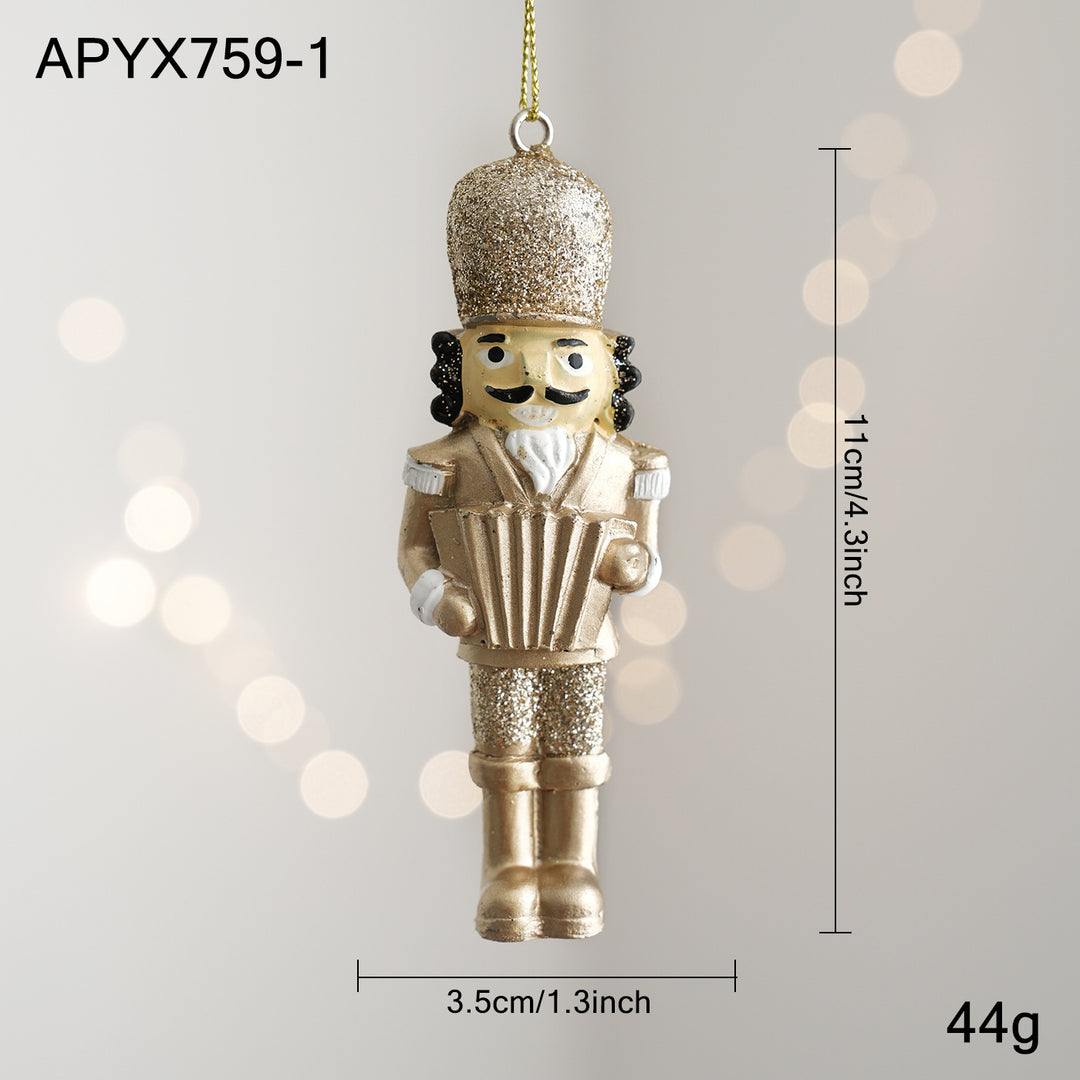 Golden nutcracker pendant made of resin for the Christmas tree