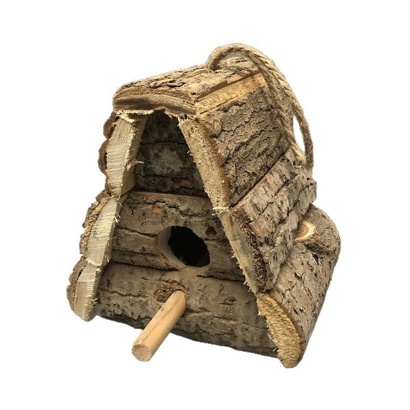 Rustic birdhouse made of wood with bark