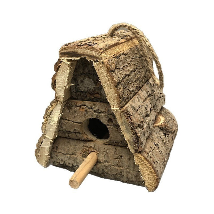 Rustic birdhouse made of wood with bark
