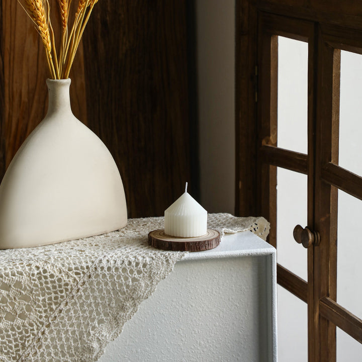 White tapered candle with striped pattern, Nordic