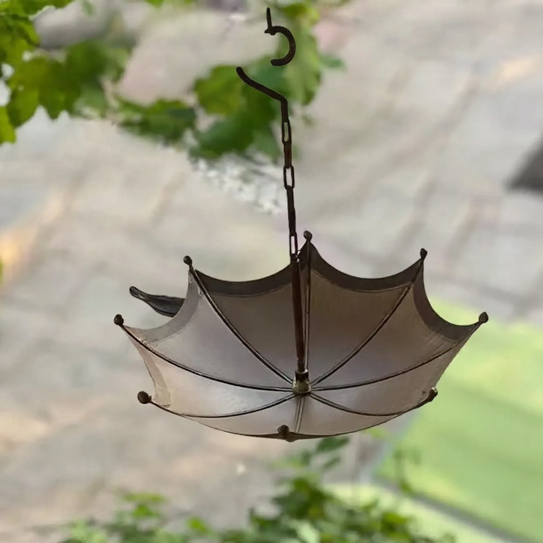 Decorative feeding station for birds in umbrella shape