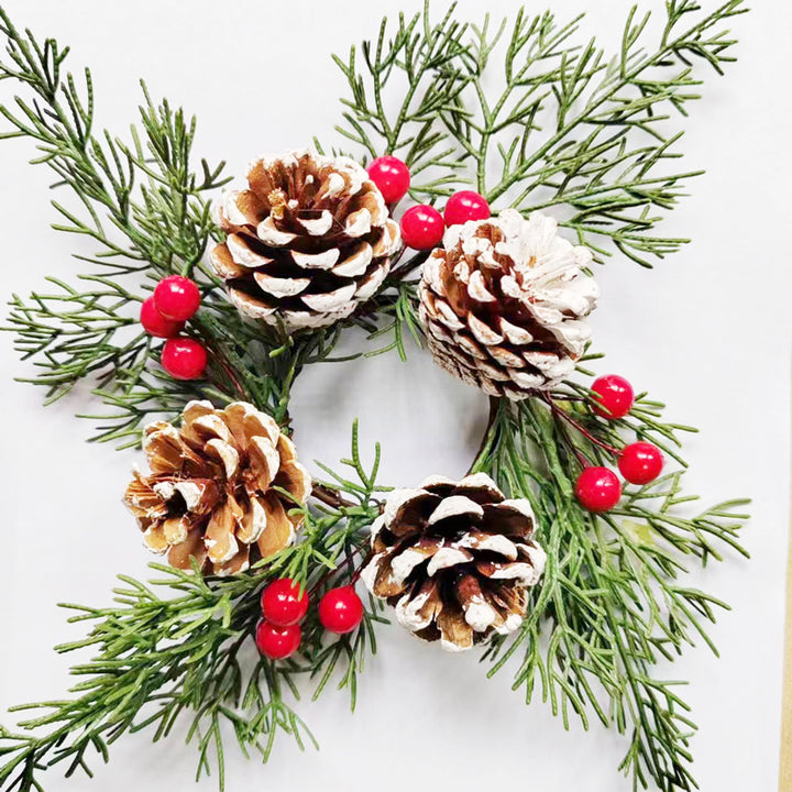 Christmas candle wreath with pine needles and berries
