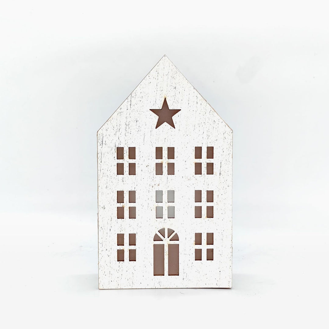 Christmas wooden house with lighting as table decoration