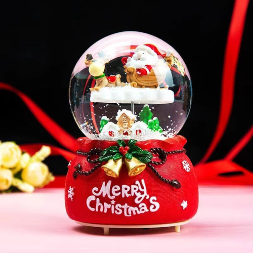 Illuminated snow globe music box with music