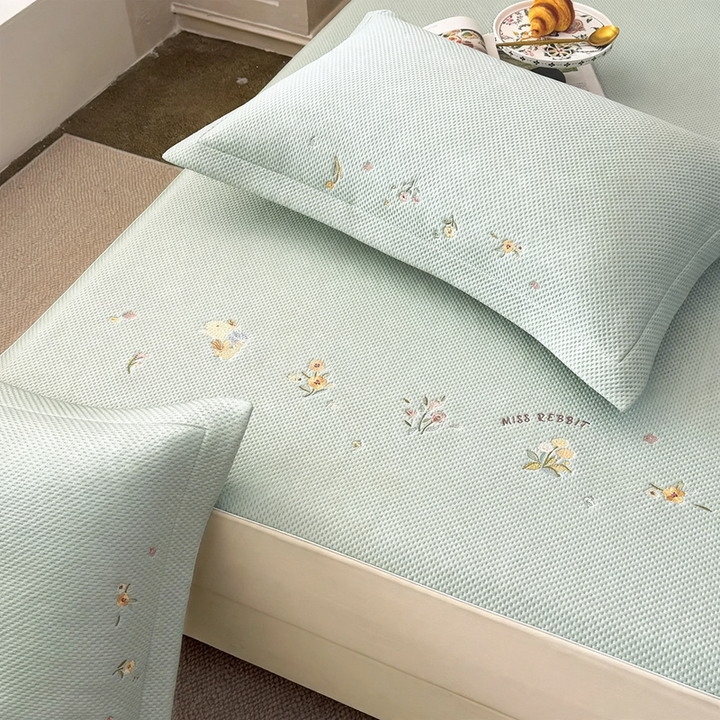 Embroidered bed sheets with floral pattern and pillowcases
