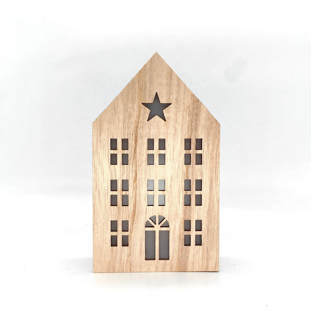 Christmas wooden house with lighting as table decoration