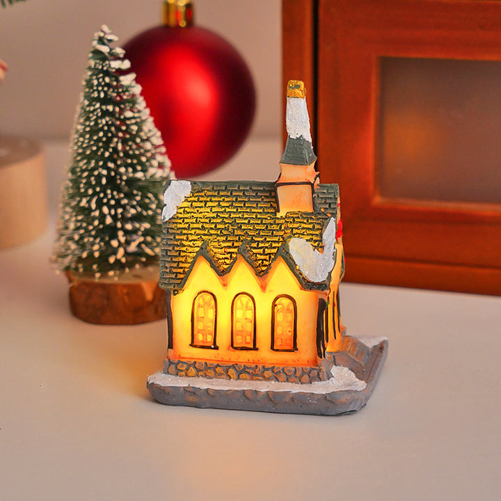 Illuminated Christmas cottage made of resin