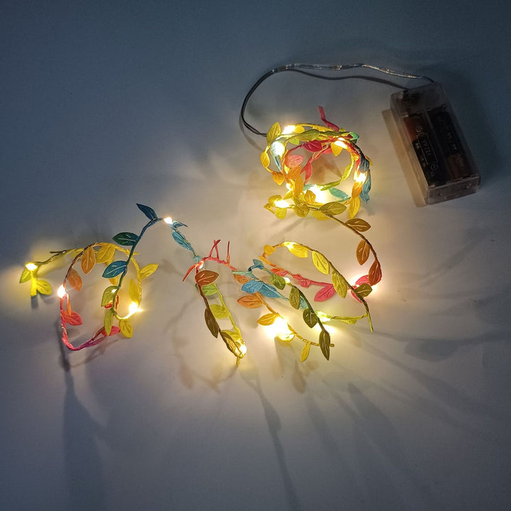 LED light chain with artificial leaves