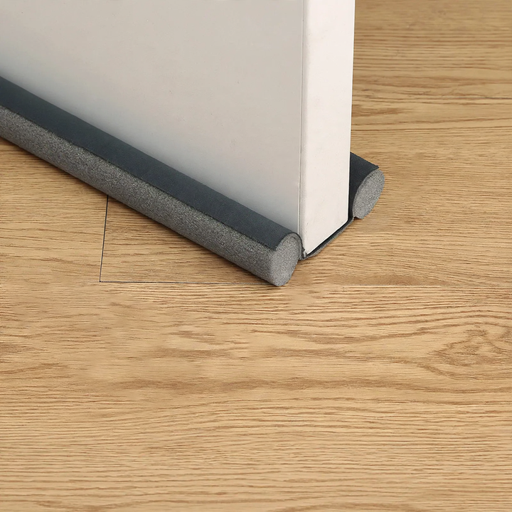Door bottom seal for sound insulation and draft protection