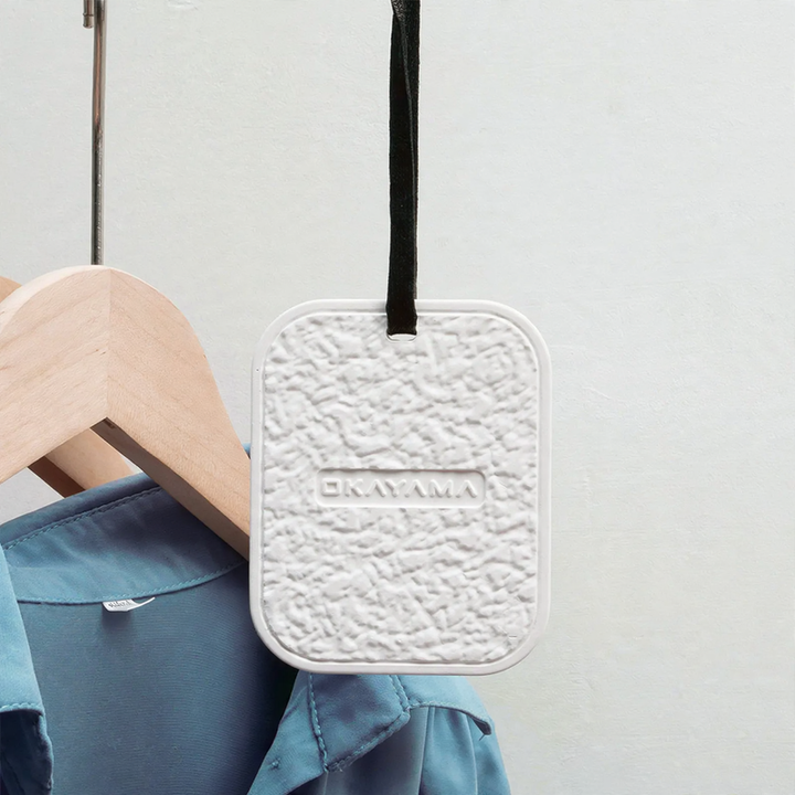 Hanging diatomaceous earth dehumidifier for cabinets