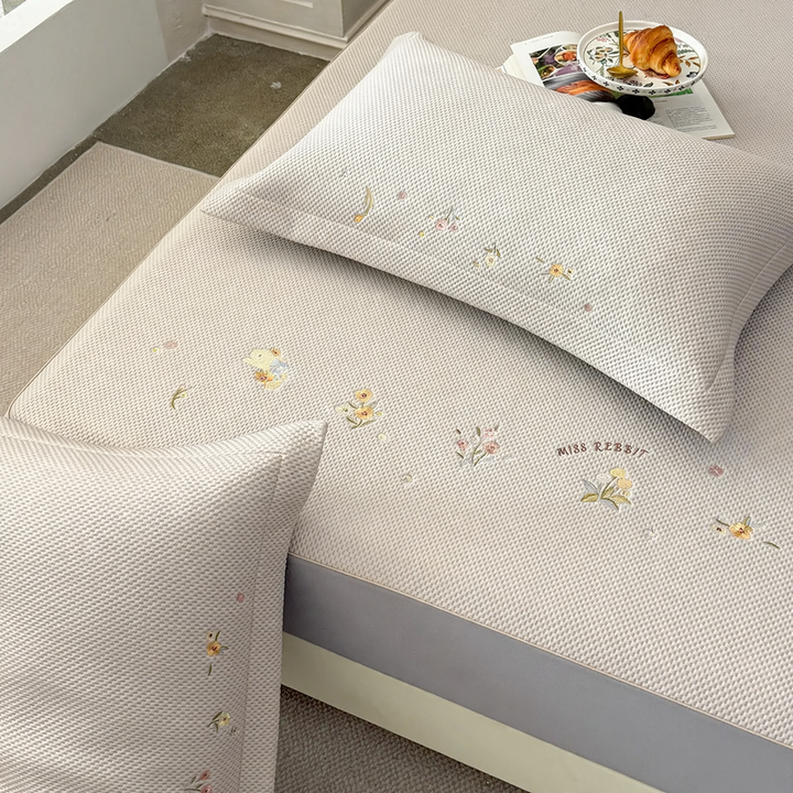 Embroidered bed sheets with floral pattern and pillowcases