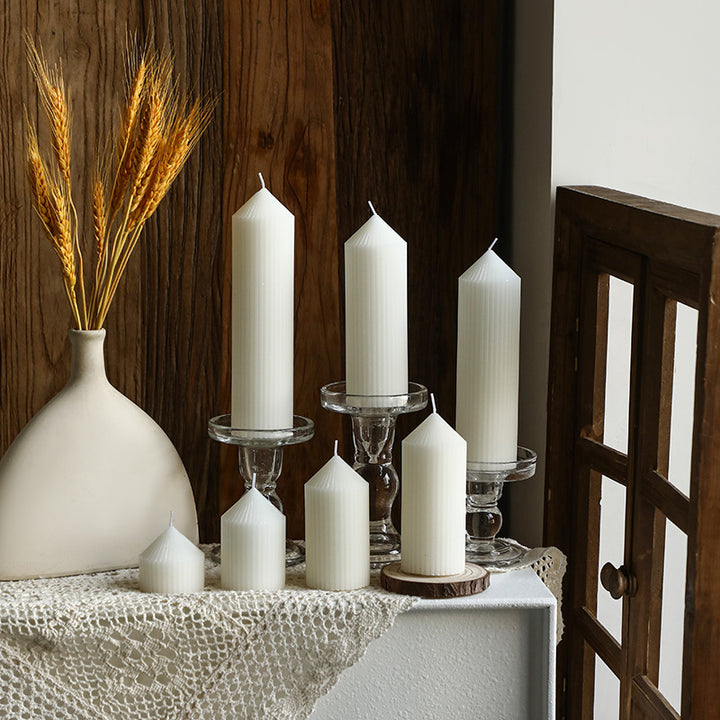 White tapered candle with striped pattern, Nordic